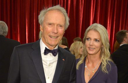 Clint Eastwood and Christina Sandera - Feb 2015 - Academy Awards - Hollywood, California - Getty BangShowbiz