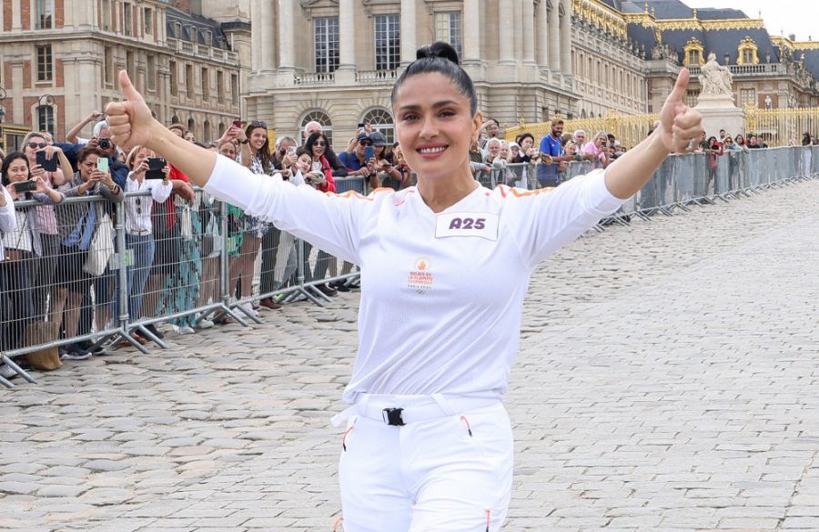 Salma Hayek poses during the Paris Olympics torch relay on July 23, 2024 in Versailles - Getty BangShowbiz